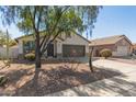 Inviting single-story home featuring desert landscaping and a two-car garage at 43945 W Juniper Ave, Maricopa, AZ 85138