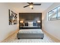 Chic bedroom with a gray accent wall and recessed lighting at 4932 W Golden Ln, Glendale, AZ 85302