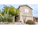 Attractive home with desert landscaping, a two-car garage, and security system at 7500 E Deer Valley Rd # 59, Scottsdale, AZ 85255