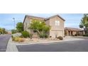 Charming two-story home boasts desert landscaping, a two-car garage, and a tile roof at 7500 E Deer Valley Rd # 59, Scottsdale, AZ 85255