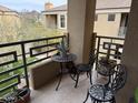 The patio has a decorative table, chairs, and potted plants creating a relaxing outdoor space at 7887 N 16Th St # 227, Phoenix, AZ 85020