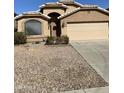 A view of the home's exterior featuring a front yard with desert landscaping at 8648 W Fargo Dr, Peoria, AZ 85382