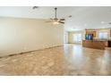 Spacious living room with tiled floor and ceiling fan with lighting at 1186 E Bradstock Way, San Tan Valley, AZ 85140
