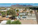 Aerial view of a house with a mountain backdrop on a sunny day at 1426 E 19Th Ave, Apache Junction, AZ 85119