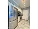 Modern kitchen with stainless steel appliances, white cabinetry, and tile flooring at 1701 E Colter St # 226, Phoenix, AZ 85016
