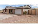 Exterior view of home showing attached garage, driveway, and landscaping at 1713 E Westchester Dr, Tempe, AZ 85283