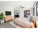 Bright and airy main bedroom featuring sliding glass doors and neutral decor at 2014 S Archer Cir, Mesa, AZ 85209