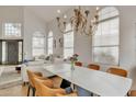 Dining room with vaulted ceilings, chandelier and view of the entry at 2158 W Peninsula Cir, Chandler, AZ 85248
