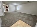 Spacious living room with neutral carpet and natural light from a bright window at 4669 E Sierrita Rd, San Tan Valley, AZ 85143
