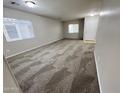 Bright and airy living room with fresh neutral paint, carpet, and natural light at 4669 E Sierrita Rd, San Tan Valley, AZ 85143
