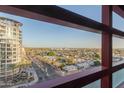 A wide-angle view of the surrounding urban environment as seen through the home's windows at 4808 N 24Th St # 906, Phoenix, AZ 85016