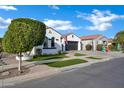 Attractive single-story home with well-maintained landscaping and a wide driveway for multiple cars at 5172 S Seton Ave, Gilbert, AZ 85298