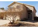 A well-maintained home exterior featuring neutral stucco, a tile roof, and desert landscaping at 7830 S 26Th St, Phoenix, AZ 85042