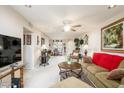 Open living room featuring a ceiling fan, comfortable furnishings, and abundant natural light throughout at 12212 N Paradise Village S Pkwy # 146, Phoenix, AZ 85032