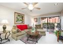 Cozy living room with comfortable seating, decor, sliding doors to the outside patio area at 12212 N Paradise Village S Pkwy # 146, Phoenix, AZ 85032