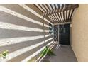 Close-up of the front entrance with a pergola that provides shade to the entryway at 1360 E Brown Rd # 9, Mesa, AZ 85203