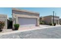 Front view of a single-story home showcasing the garage and desert-style landscaping for low maintenance at 1360 E Brown Rd # 9, Mesa, AZ 85203