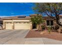 Charming single-story home featuring desert landscaping, three-car garage, and neutral color palette at 15062 W Windward Ave, Goodyear, AZ 85395