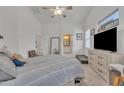 Tranquil bedroom with neutral tones, and a large window offering natural light at 16847 W Marconi Ave, Surprise, AZ 85388