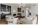Bright living room featuring built-in shelving, a fireplace, and comfortable seating at 1700 E Lakeside Dr # 16, Gilbert, AZ 85234