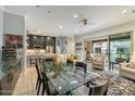 Open-concept living area featuring modern finishes, recessed lighting, and seamless access to a charming outdoor patio at 17773 N 77Th Way, Scottsdale, AZ 85255