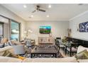 Cozy living room with a glass dining table set and large windows offering an abundance of natural light at 17773 N 77Th Way, Scottsdale, AZ 85255