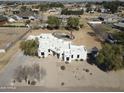 Expansive aerial view of white adobe home, pool and desert landscaping at 22236 E Nacoma --, Queen Creek, AZ 85142