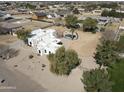 Expansive aerial view of white adobe home, pool and desert landscaping at 22236 E Nacoma --, Queen Creek, AZ 85142