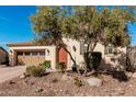Charming single-story home with a well-manicured front yard, desert landscaping and a two car garage at 28798 N 127Th Ave, Peoria, AZ 85383