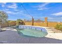 Sparkling blue tiled pool, perfect for relaxation with desert views and a secure fence at 2910 E Quiet Hollow Ln, Phoenix, AZ 85024