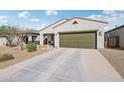 Charming single-story home features a well-maintained yard and an attached two-car garage at 45734 W Sky Ln, Maricopa, AZ 85139