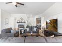 Cozy living room with a fireplace, plush sofas, and stylish decor at 6208 E Lonesome Trl, Cave Creek, AZ 85331