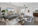 Bright living room featuring neutral tones, modern decor, and lots of natural light at 8117 E Sweet Bush Ln, Gold Canyon, AZ 85118