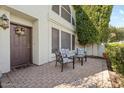 Cozy front patio featuring brick pavers and comfortable outdoor seating area near the front door at 8813 S 51St St # 3, Phoenix, AZ 85044