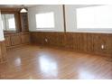 Bright living room featuring wood-look flooring and ample natural light at 9501 E Broadway Rd # 237, Mesa, AZ 85208