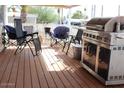 Covered patio area featuring outdoor seating and a built-in grill at 9501 E Broadway Rd # 237, Mesa, AZ 85208