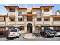 Inviting exterior of a condo building featuring balconies and covered parking, ideal for modern living at 10410 N Cave Creek Rd # 2034, Phoenix, AZ 85020