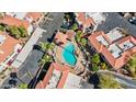 A beautiful aerial shot showcases a refreshing community pool surrounded by lush landscaping and lounge chairs at 10410 N Cave Creek Rd # 2034, Phoenix, AZ 85020