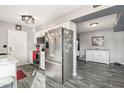 Modern kitchen featuring stainless steel appliances and an open layout to the adjoining living space at 10533 W Granada Dr, Sun City, AZ 85373