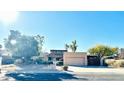 Inviting single-story home featuring a well-maintained desert landscape and a spacious two-car garage at 13234 N 2Nd St, Phoenix, AZ 85022