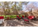 Outdoor patio with comfortable seating and a view of landscaped greenery at 1350 S Greenfield Rd # 1215, Mesa, AZ 85206