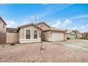 Lovely home with a two-car garage and low-maintenance front yard at 1565 E 10Th St, Casa Grande, AZ 85122