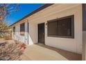 The front entrance of home features a security door and neutral exterior paint at 15811 N 23Rd St, Phoenix, AZ 85022