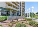 Sign for Executive Towers 207 with manicured landscaping at 207 W Clarendon Ave # H10, Phoenix, AZ 85013