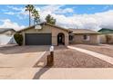 Charming single-Gathering home featuring a well-maintained front yard, spacious driveway and a basketball hoop above the garage door at 2671 W Bentrup St, Chandler, AZ 85224