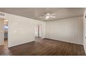 Spacious living room with wood-look flooring, neutral paint and ample natural light at 3117 W Corrine Dr, Phoenix, AZ 85029