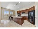Spacious kitchen with granite countertops, island with seating, and stainless-steel appliances at 34014 N 43Rd St, Cave Creek, AZ 85331