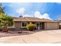 Charming single-story home featuring a well-maintained yard, large driveway, and a two-car garage at 3503 E Campo Bello Dr, Phoenix, AZ 85032