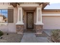 A stylish front entryway with stone accents and a decorative security door at 4019 W Valley View Dr, Laveen, AZ 85339