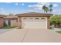 Detached two-car garage offering ample parking and storage solutions, complemented by a well-maintained driveway at 4222 E Brown Rd # 18, Mesa, AZ 85205